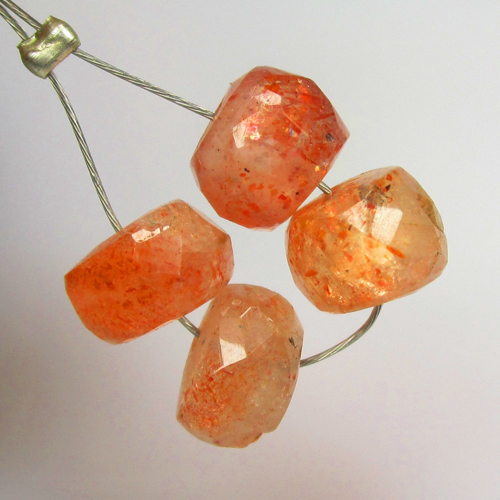 6.35 Ctw Natural 4 Drilled Orange Sunstone Round Beads: No Reserve! Title: 6.35 Ctw Natural 4 Drilled Orange Sunstone Round Beads Stone Clarity: Opaque Gemstone:Natural Sunstone Beads Carat Weights: 6.35 Size/Dimensions: 6.60 - 6.80 mm / 4 P'cs Additional
