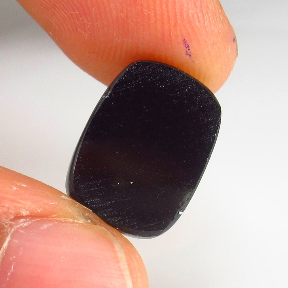 4.80 Ct - Natural Balck Onyx: No Reserve! Title: 4.80 Ct - Natural Balck Onyx Description: Gemstone Gemstones: Onyx Carat Weights: 4.8 Size/Dimensions:14.4 x 10.5 x 3.0 mm Additional Info:Pieces : 1 No's / Shape - Cushion Cab / Co