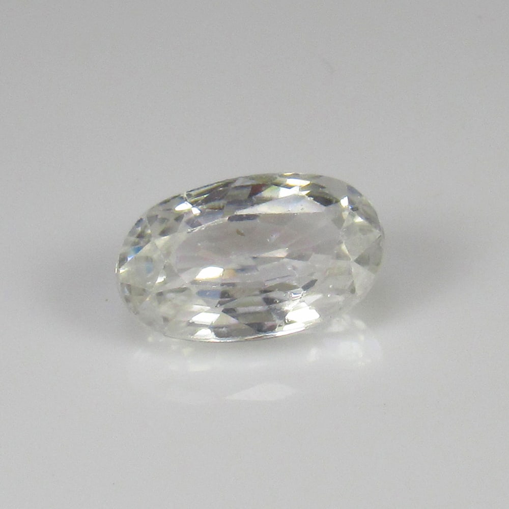 Natural White Zircon - 3.53 Ct: No Reserve! Title: Natural White Zircon - 3.53 Ct Origin: Combodia Weight:3.53 Size/Dimensions: 10.0 x 6.3 x 4.5 mm Description: Pieces : 1 No's / Shape : Oval Cut / Color : White / Clarity : VVS - Tr