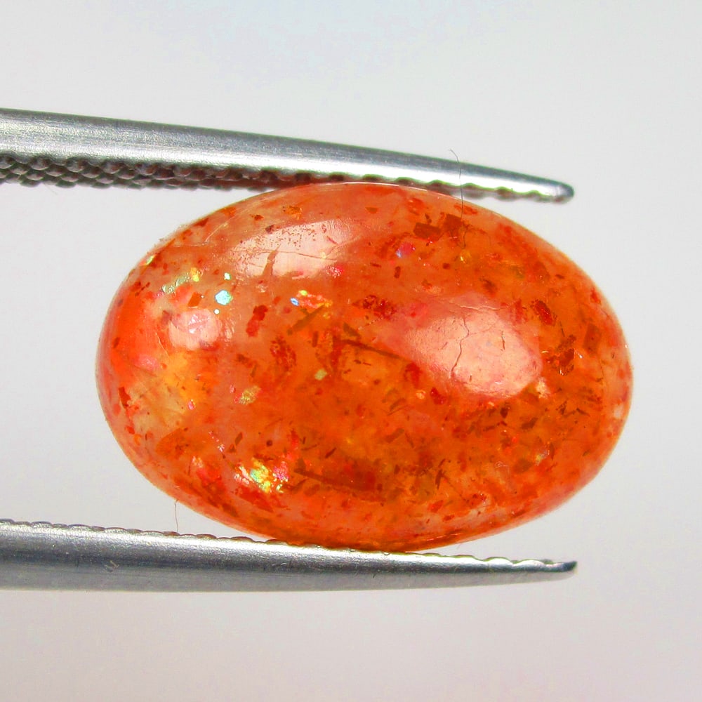 4.05 Ctw Natural Orange Sunstone Oval Cab: No Reserve! Title: 4.05 Ctw Natural Orange Sunstone Oval Cab Stone Clarity: Opaque Gemstone:Natural Sunstone Carat Weights: 4.05 Size/Dimensions: 13.20 x 9.00 x 4.50 mm Additional Info:Oval Cab / Good