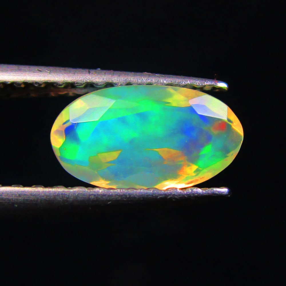 0.55 Ctw Natural Ethiopian Multicolor Opal Oval Cut: No Reserve! Title: 0.55 Ctw Natural Ethiopian Multicolor Opal Oval Cut Stone Clarity: Transparent Gemstone:Natural Opal Carat Weights: 0.55 Size/Dimensions: 8.10 x 4.50 x 3.20 mm Additional Info:Excel
