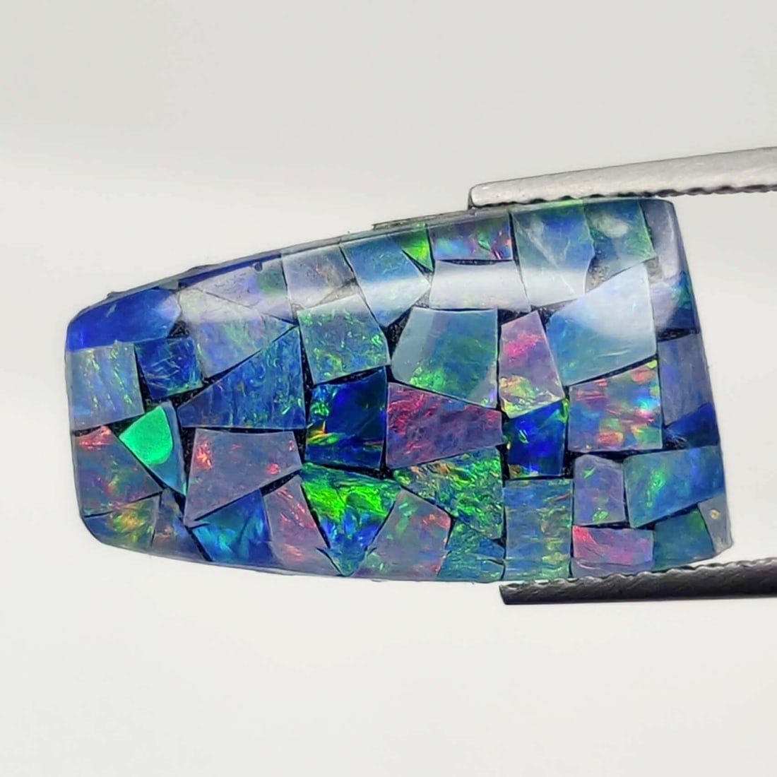 7.15 ct Australian Triplet Composite Mosaic Opal: No Reserve! Title: 7.15 ct Australian Triplet Composite Mosaic Opal Description: Gemstones: Australian Doublet Opal Carat Weights: 7.15 ct Size/Dimensions: 18.80 X 11.40 X 3.70 mm Materials &Technique