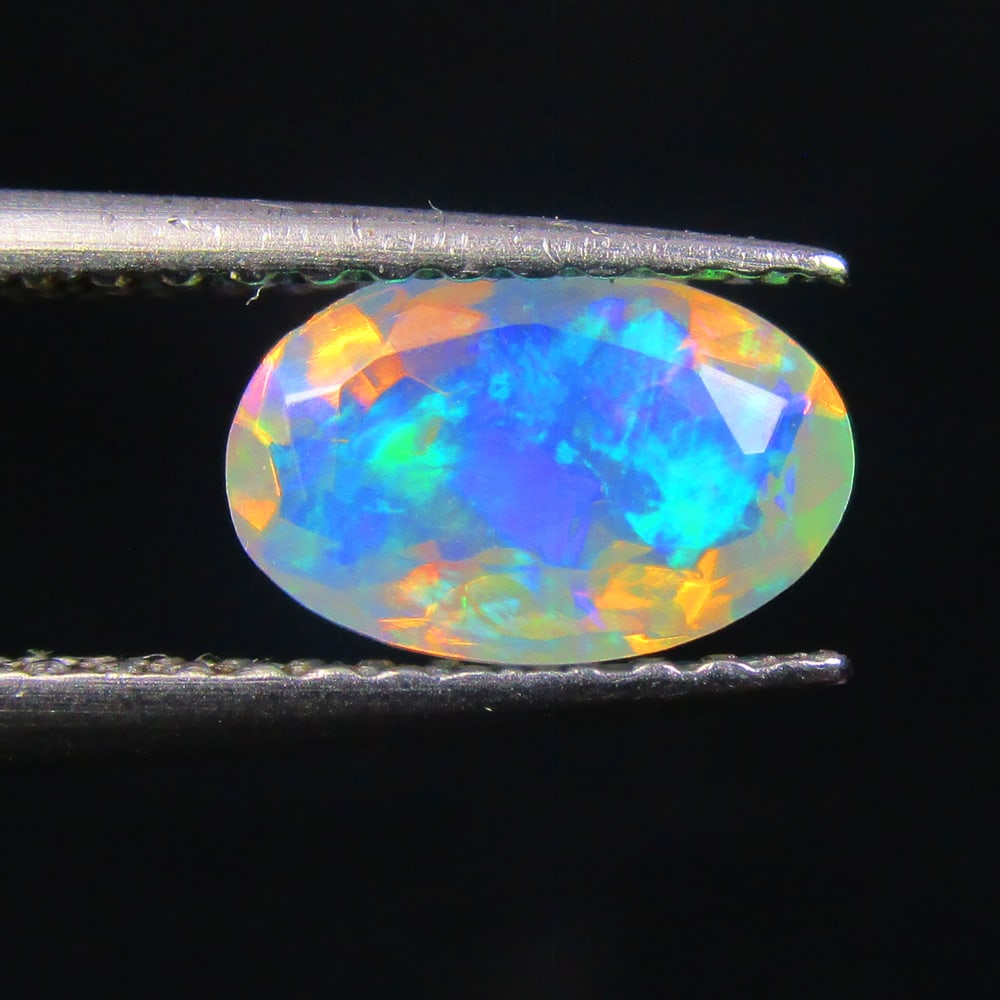 0.59 Ctw Natural Ethiopian Multicolor Opal Oval Cut: No Reserve! Title: 0.59 Ctw Natural Ethiopian Multicolor Opal Oval Cut Stone Clarity: Transparent Gemstone:Natural Opal Carat Weights: 0.59 Size/Dimensions: 7.70 x 4.70 x 3.60 mm Additional Info:Excel