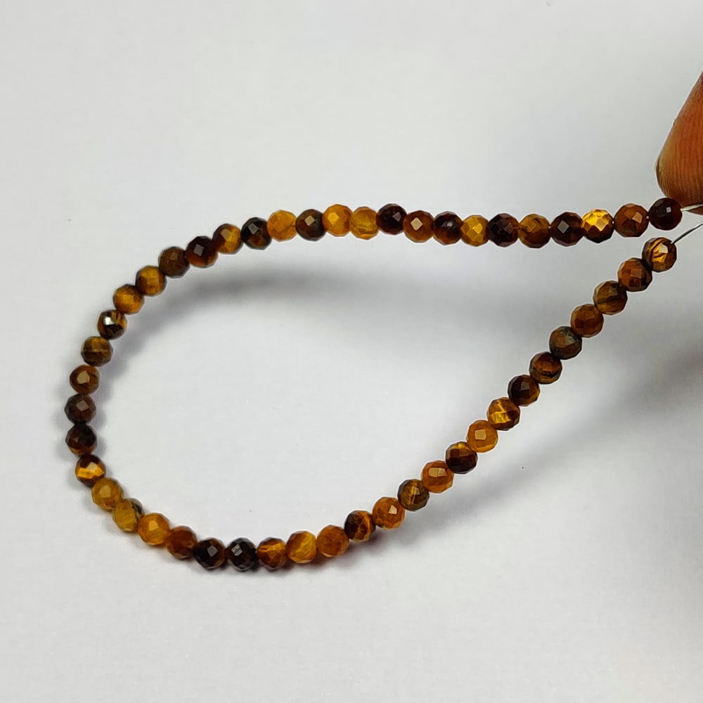 11.90 Ctw Natural 49 Drilled Tiger's Eye Round Ball Beads: No Reserve! Title: 11.90 Ctw Natural 49 Drilled Tiger's Eye Round Ball Beads Stone Clarity: Opaque Gemstone:Natural Tiger's Eye Beads Carat Weights: 11.9 Size/Dimensions: 3.20 - 3.50 mm / 49 P'cs Addi