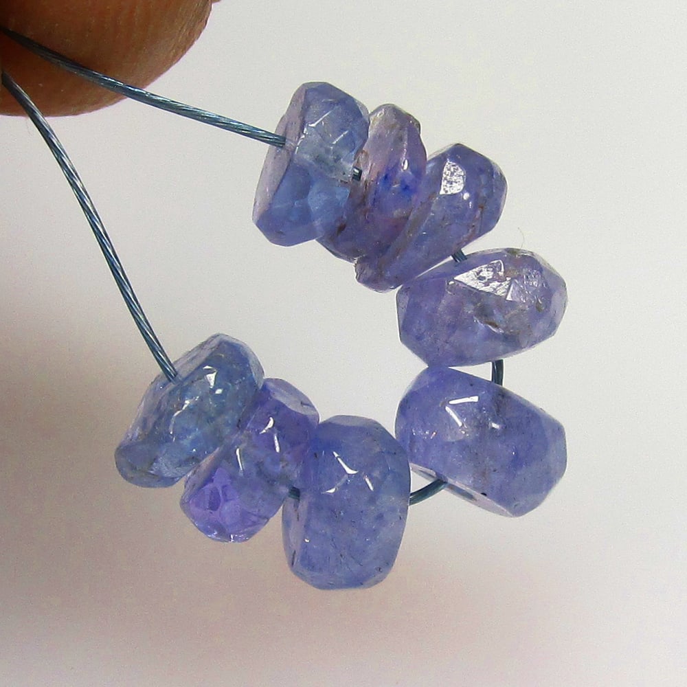 4.77 Ctw Natural Tanzanite Round Beads: No Reserve! Title: 4.77 Ctw Natural Tanzanite Round Beads Stone Clarity: SI Gemstone:Natural Tanzanite Beads Carat Weights: 4.77 Size/Dimensions: 4.50 - 5.20 mm / 8 Pc's Additional Info:Top Quality Lu