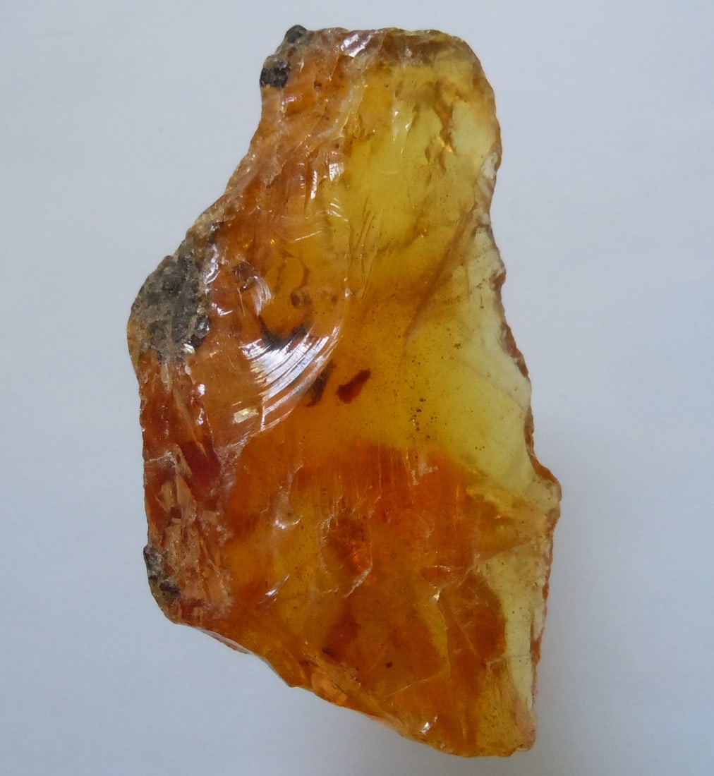5.80 Gram 100 Mill. Years Old Rough Burmite Amber: Title: 5.80 Gram 100 Mill. Years Old Rough Burmite Amber Origin: Hukawang Valley, Kachin State, Myanmar Size: 4x2.5x1.5 cm / 5.80 gram Description: yellow transparent rough burmite amber Reserve: $6.0