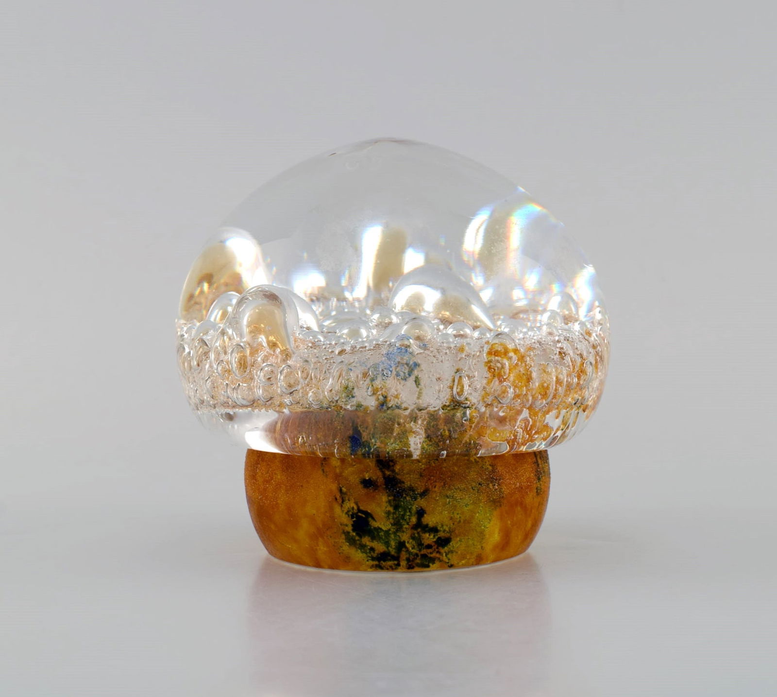 Göran Wärff for Kosta Boda. Paper weight shaped as a mushroom in amber colored and clear: Title: Göran Wärff for Kosta Boda. Paper weight shaped as a mushroom in amber colored and clear mouth-blown art glass with inlaid bubbles. Swedish design, 1970s. Description: Göran W