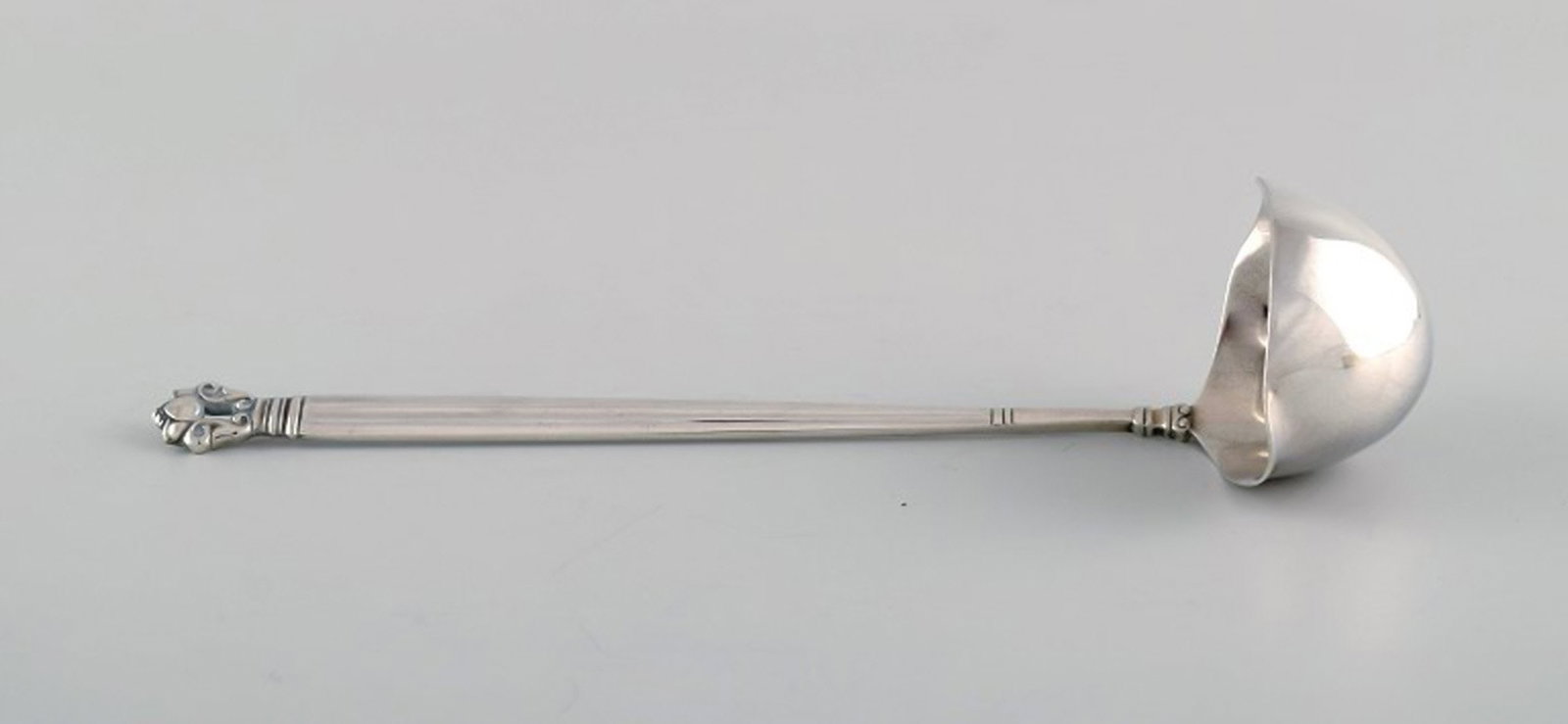 Georg Jensen Acorn sauce spoon in sterling silver.: Title: Georg Jensen Acorn sauce spoon in sterling silver. Description: Georg Jensen Acorn sauce spoon in sterling silver. Length: 17.5 cm. In very good condition. Stamped. Reserve: $190.00 Shipping: D