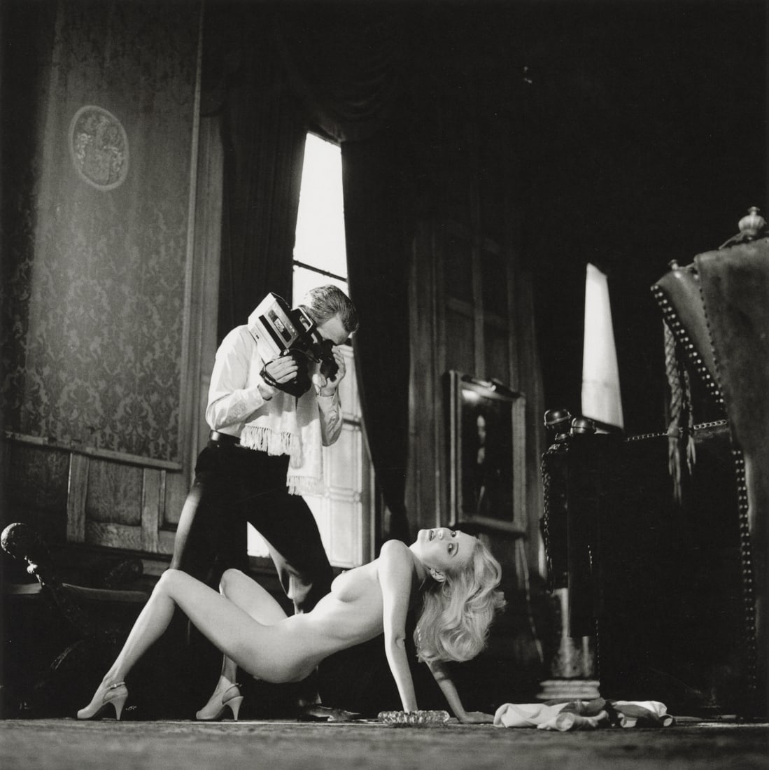 HELMUT NEWTON - Voyeurism, American Playboy, 1989: Artist: Helmut Newton Title: Voyeurism, American Playboy, Los Angeles, 1989 Medium: Photo Litho, 2009, Italy Dimensions: 9.65x9.65" Description: Heat Wax Mounted on 12x16" Conservation Board Artist Bi