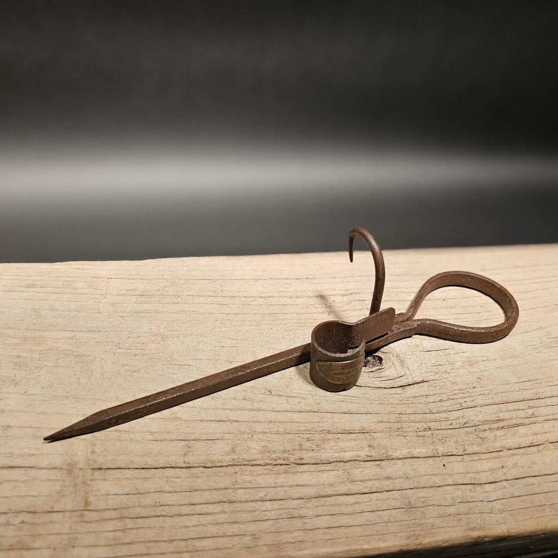 Wrought Iron Mining Sticking Tommy Miners Candlestick: 10 1/2" Long Nice Reproduction iron miners candle holder. Great handmade distressed to look like an antique.... Miner spikes like this were used in the mining trade & era. The spike would be hammered