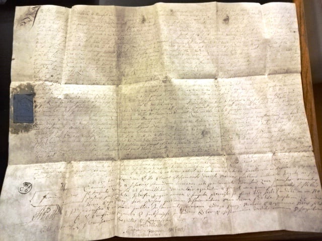 1716 Vellum Manuscript Scotland Signed Stamped: A large folding vellum instrument penned in Scotland in English detailing a real estate transaction. Signed at bottom and nice docket on verso. Blue revenue stamp and tax stamp on verso Very Good, in 