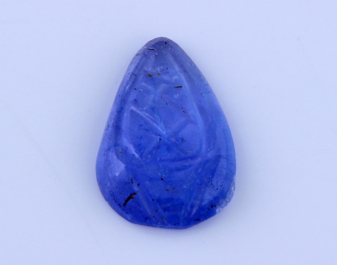 Beautiful " Natural Tanzanite Carving " 2.06 Cts Natural Tanzanite Carving: No Reserve! Gemstone : Natural Tanzanite Carving Origin: Tanzania Weight : 2.06 carats Dimensions : 11.63x7.79x2.58 mm Shape/Cut: Pear Carving Color : Violet Transparency: transparent Treatment: none 