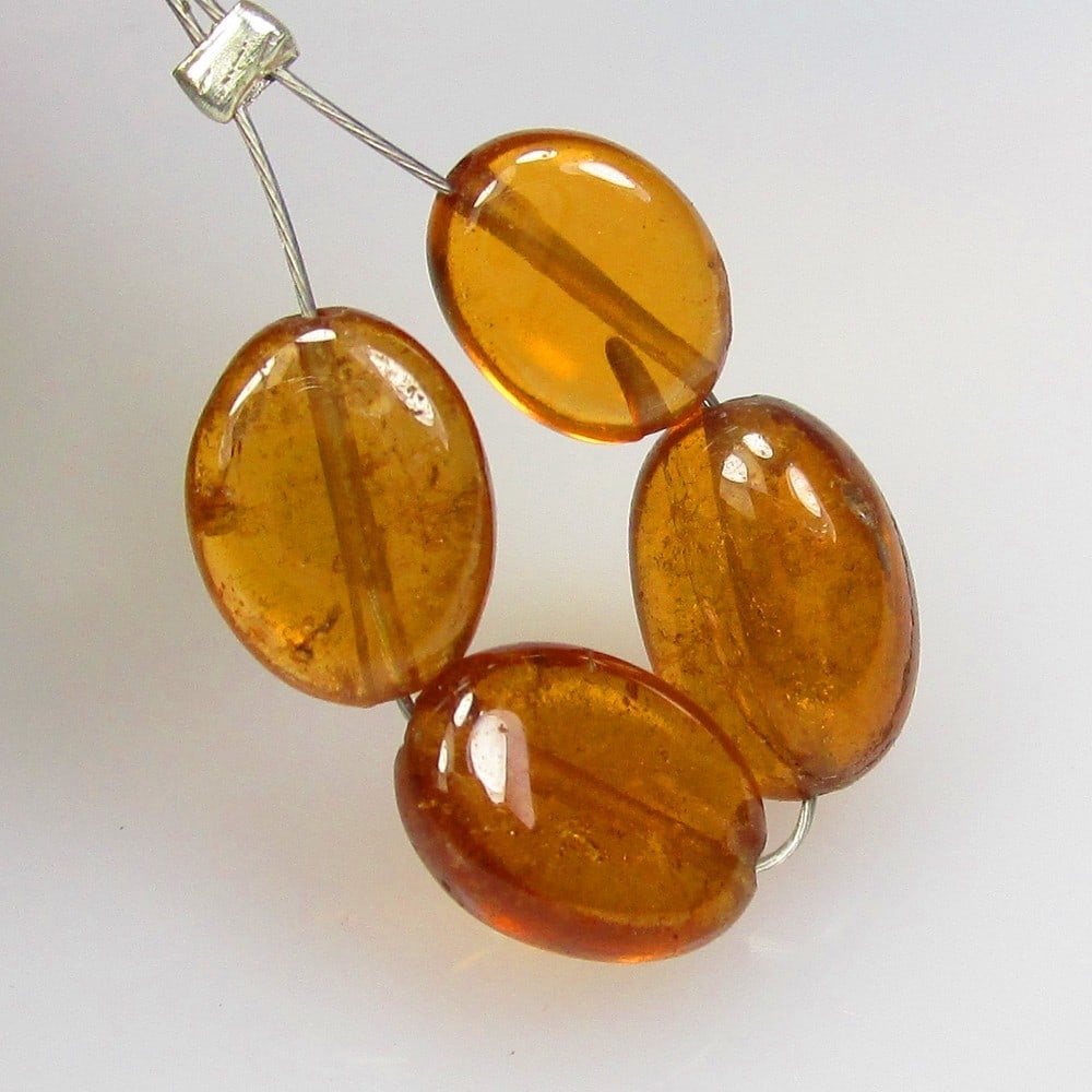 7.01 Ctw Natural 4 Hessonite Garnet Dumble Beads: No Reserve! Title: 7.01 Ctw Natural 4 Hessonite Garnet Dumble Beads Stone Clarity: Transparent Gemstone:Natural Hessonite Garnet Beads Carat Weights: 7.01 Size/Dimensions: 5.8x3.2 - 6.4x3.4 mm / 4 Pc'