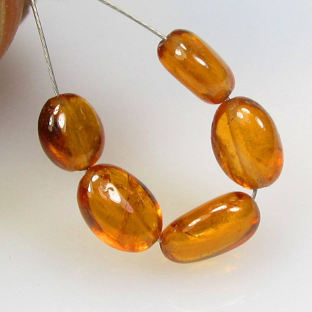 6.53 Ctw Natural 6 Hessonite Garnet Dumble Beads: No Reserve! Title: 6.53 Ctw Natural 6 Hessonite Garnet Dumble Beads Stone Clarity: Transparent Gemstone:Natural Hessonite Garnet Beads Carat Weights: 6.53 Size/Dimensions: 5.0x2.9 - 5.3x3.1 mm / 6 Pc'