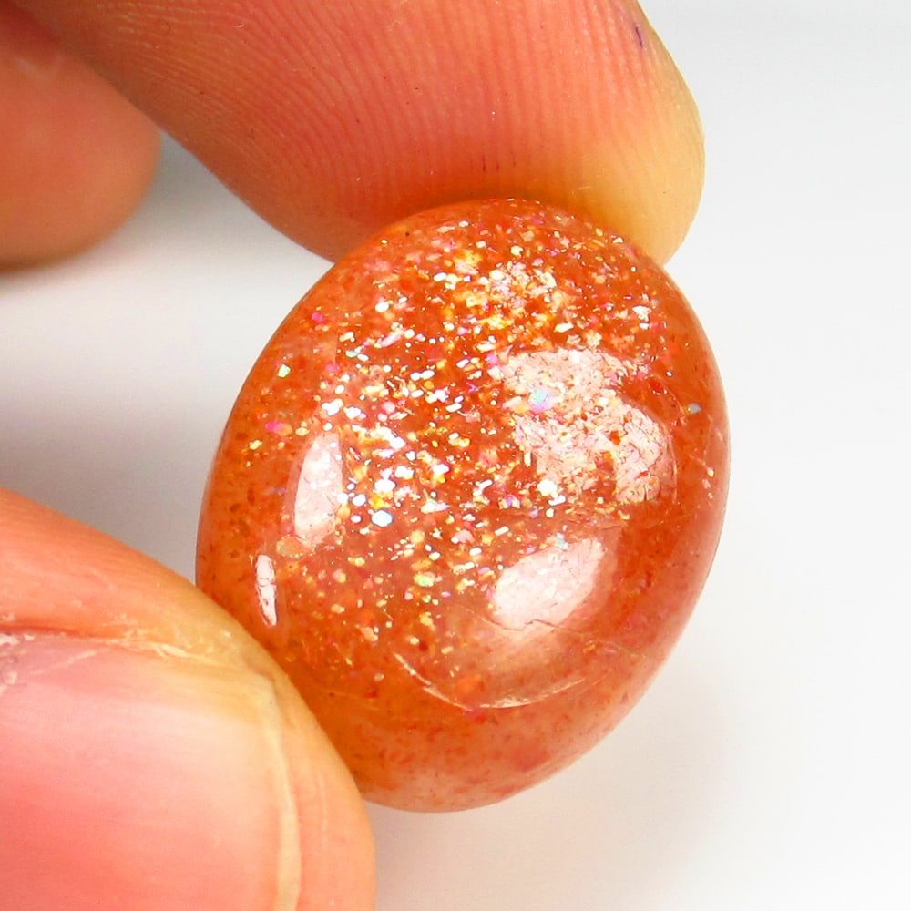 Natural Sunstone- 14.65 Ct: No Reserve! Title: Natural Sunstone- 14.65 Ct Origin: Brazil Weight: 14.65 Dimensions: 21.0 x 15.5 x 5.0 mm Description: Pieces : 1 No's / Shape : Oval Cab / Color : Orange / Clarity : Opaque / Treatm