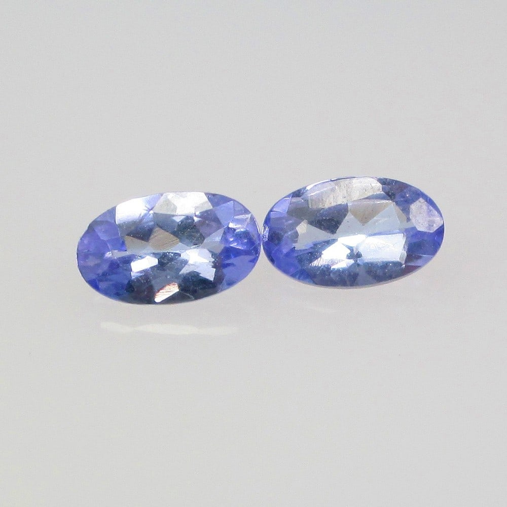 0.51 Ctw Natural Tanzanite Oval Pair: No Reserve! Title: 0.51 Ctw Natural Tanzanite Oval Pair Stone Clarity: VVS Gemstone:Tanzanite Carat Weights: 0.51 Size/Dimensions: 5.10 x 3.10 x 2.20 mm / 2 Pc's Additional Info:Top Quality Luster / E