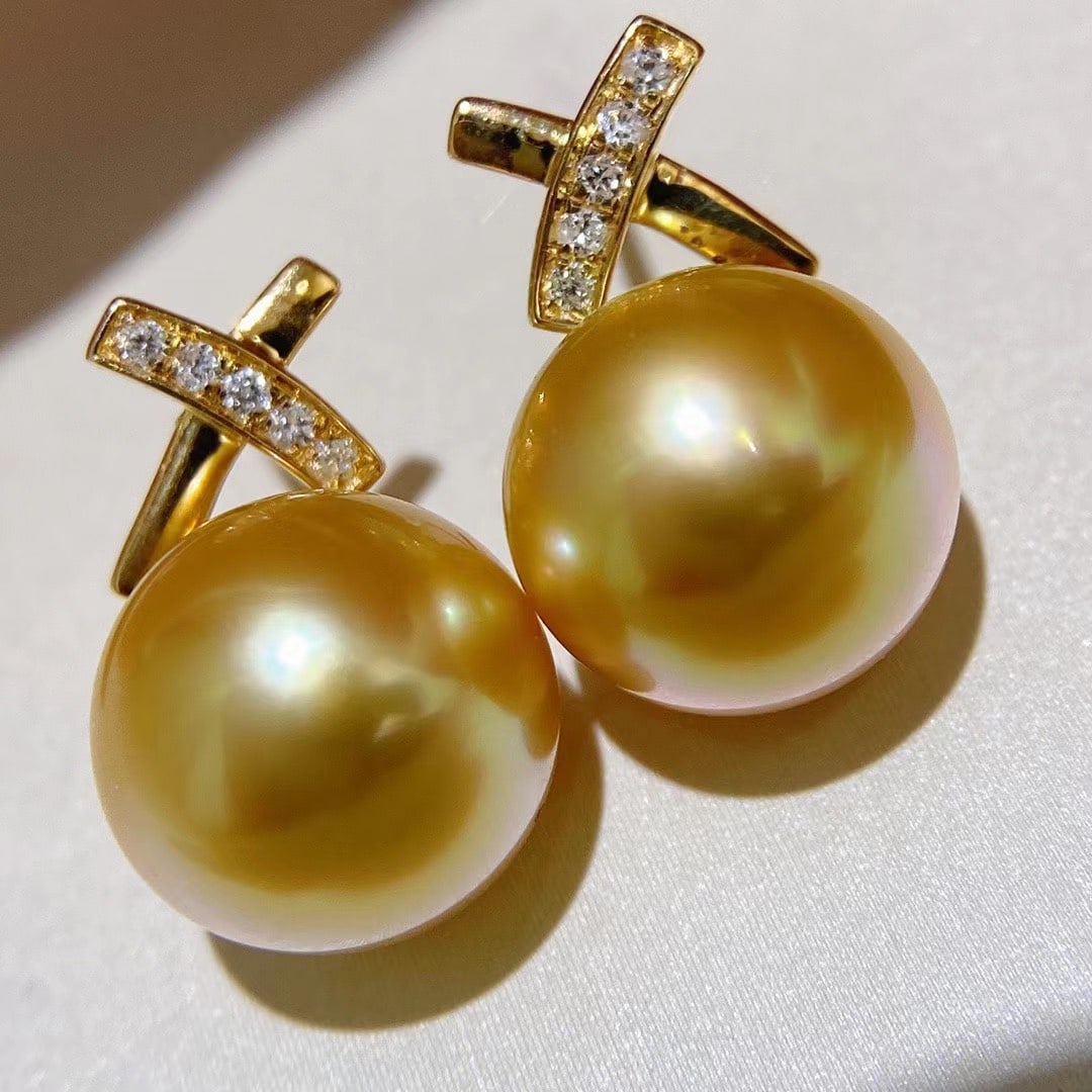 South Sea Sea Gold Pearl Earrings: South Sea Sea Gold Bead Stud Earrings. 10-11mm Gold Bead Stud Earrings, Full and Round. 18k Gold Inlaid Reserve: $1,500.00 Shipping: Domestic: Shipping rates are determined by destination Internationa