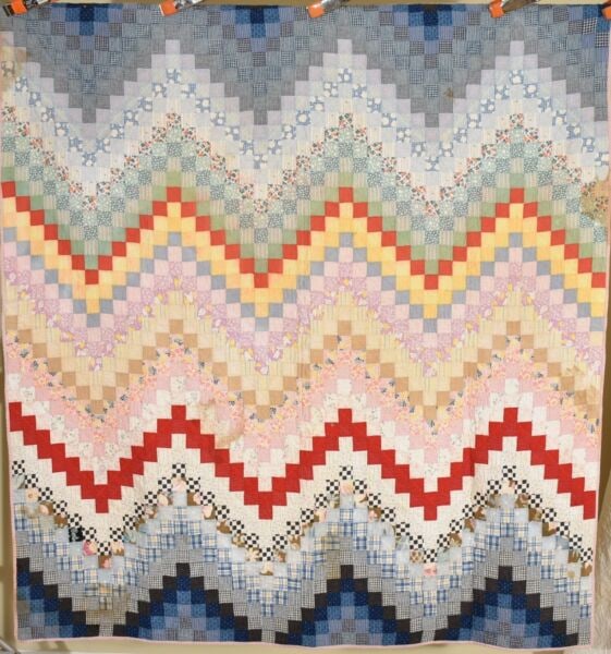 1910's "Hills & Valleys" Quilt: This MAGNIFICENT cotton 1890's - 1910's multicolor "hills and valleys" quilt is all hand pieced and hand quilted, with postage stamp pieces measuring just over 1.5" per side. It measures 66" X 72" and