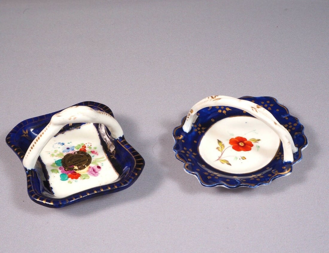 2 Antique Porcelain Cobalt Basket Tray Candy Nut Dish Set Handles Certified 1841: This is an exceptional Set of 2 (two) small Baskets/Nut Dishes/Trays. They are in cobalt blue and gold. One of them bears and British antique Dealers Association certifying that is made prior to 1841.