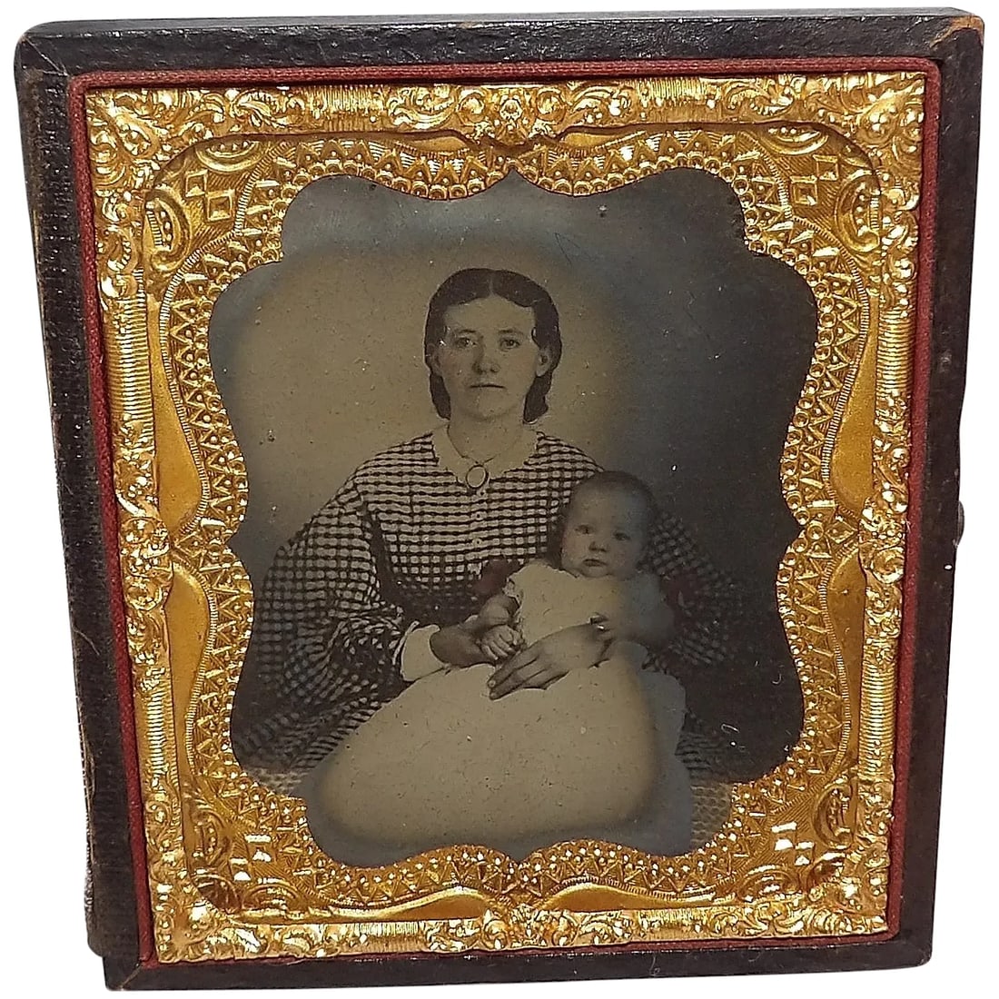 Antique Ambrotype Photo with Gold Gilt Metal and Hand Tooled Leather Frame: This Antique Ambrotype Photo with Gold Gilt Metal and Hand Tooled Leather Frame is in great condition. There is a note behind the picture stating when it was taken – 1866. Frames that are missin