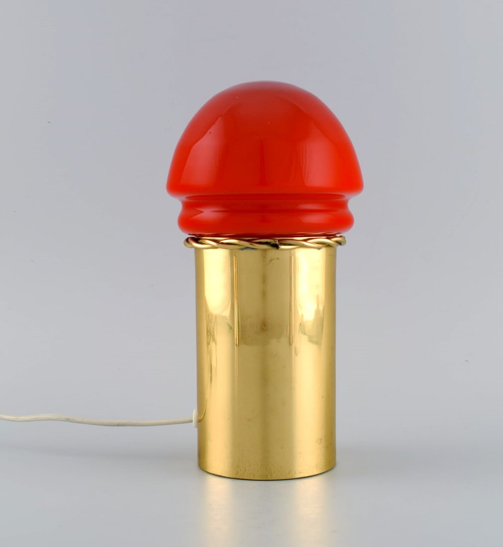 Hans Agne Jakobsson for A / B Markaryd. Brass table lamp with shade in red mouth blown art glass.: Title: Hans Agne Jakobsson for A / B Markaryd. Brass table lamp with shade in red mouth blown art glass. Swedish design, 1960s / 70s. Description: Hans Agne Jakobsson for A / B Markaryd. Brass table l