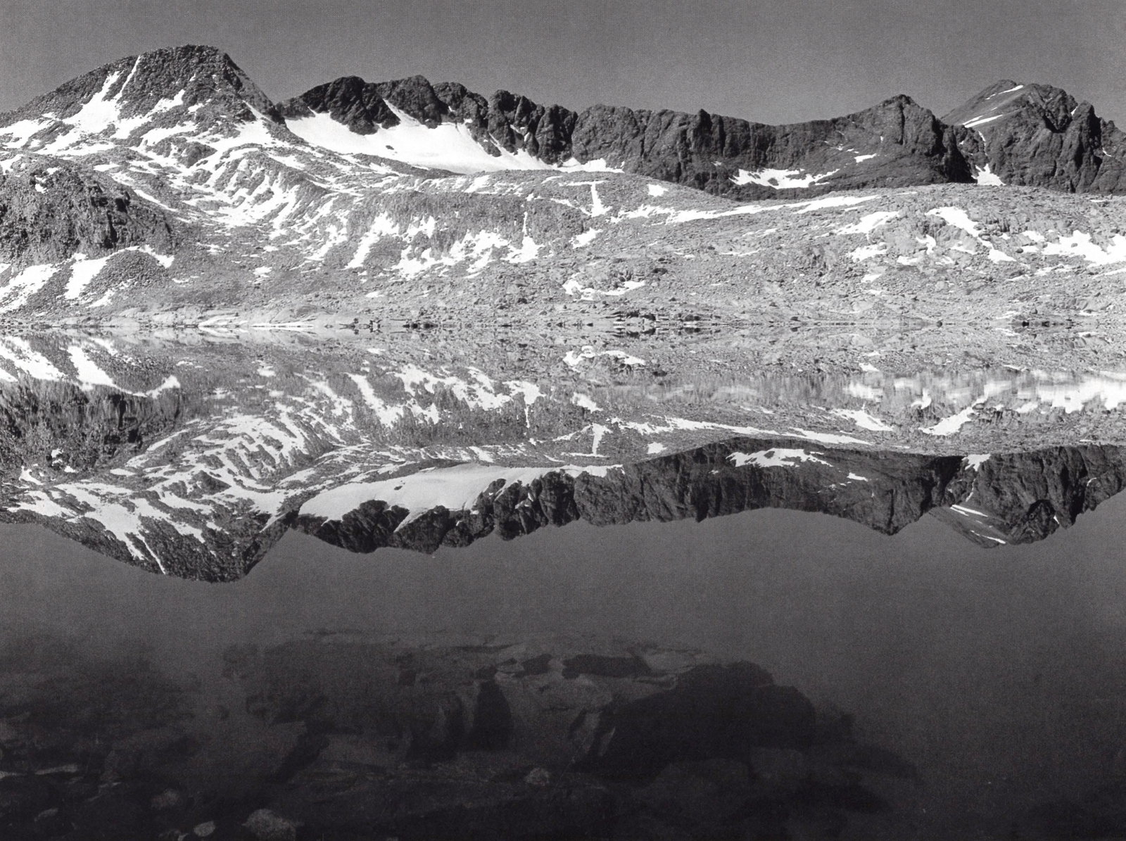ANSEL ADAMS - Lake near Muir Pass, Kings Canyon c. 1933: Artist: ANSEL ADAMS Print Title: Rock, Lake near Muir Pass, Kings Canyon c. 1933 Medium: Double Impression Photolithograph Printed 1970’s in the US Image Size: approx. 7.5 x 6” Ansel East