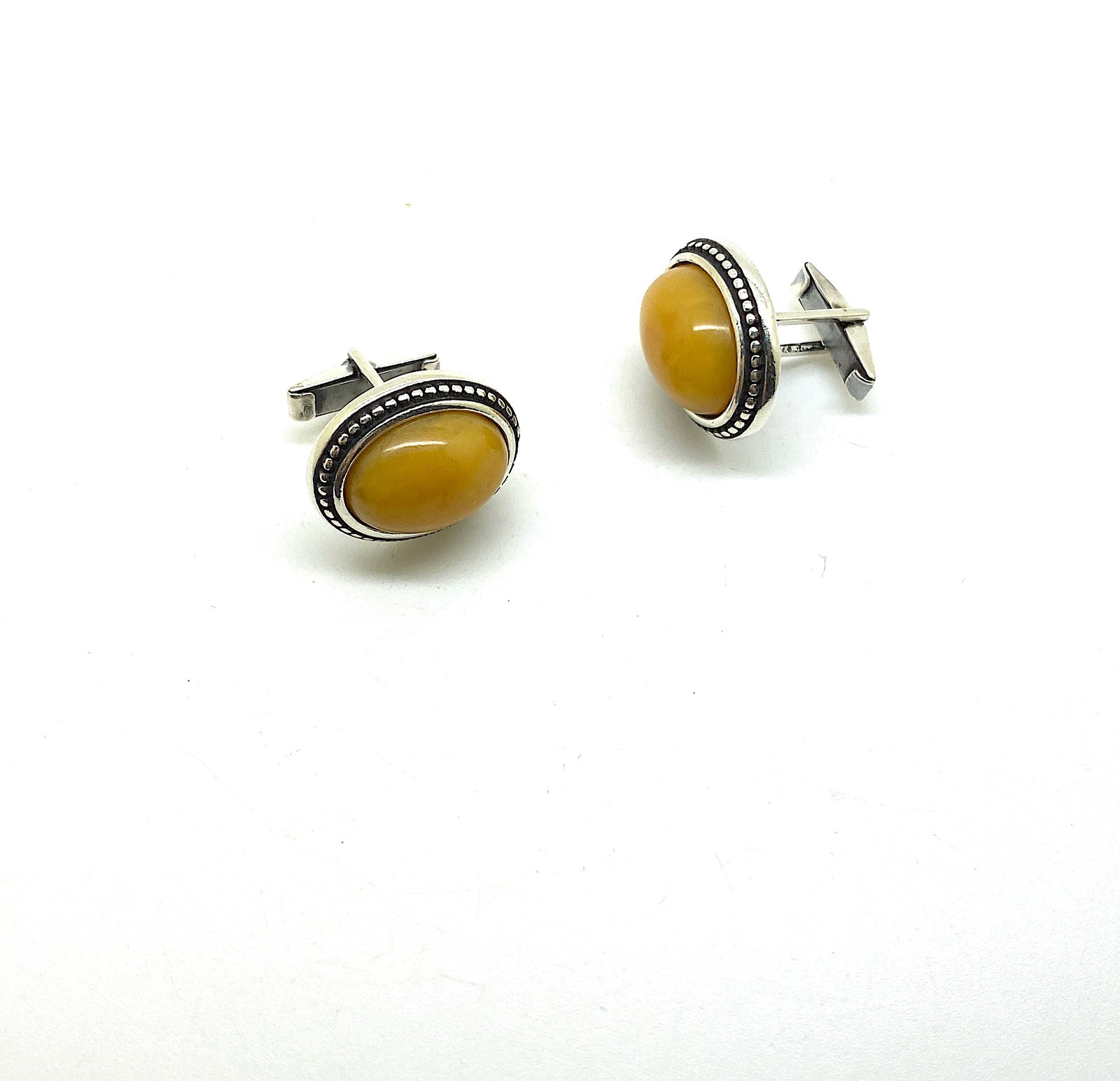 Amber Cufflinks: Title: Amber Cufflinks Metal Purity: Sterling Silver Gemstones: Amber Weight: 13.5 g Size/Dimensions: Size: 24.0 x 20.0 x 17.0 mm Size: 0.945 x 0.787 x 0.669 inches Made of: Whole Stone Additional Inf