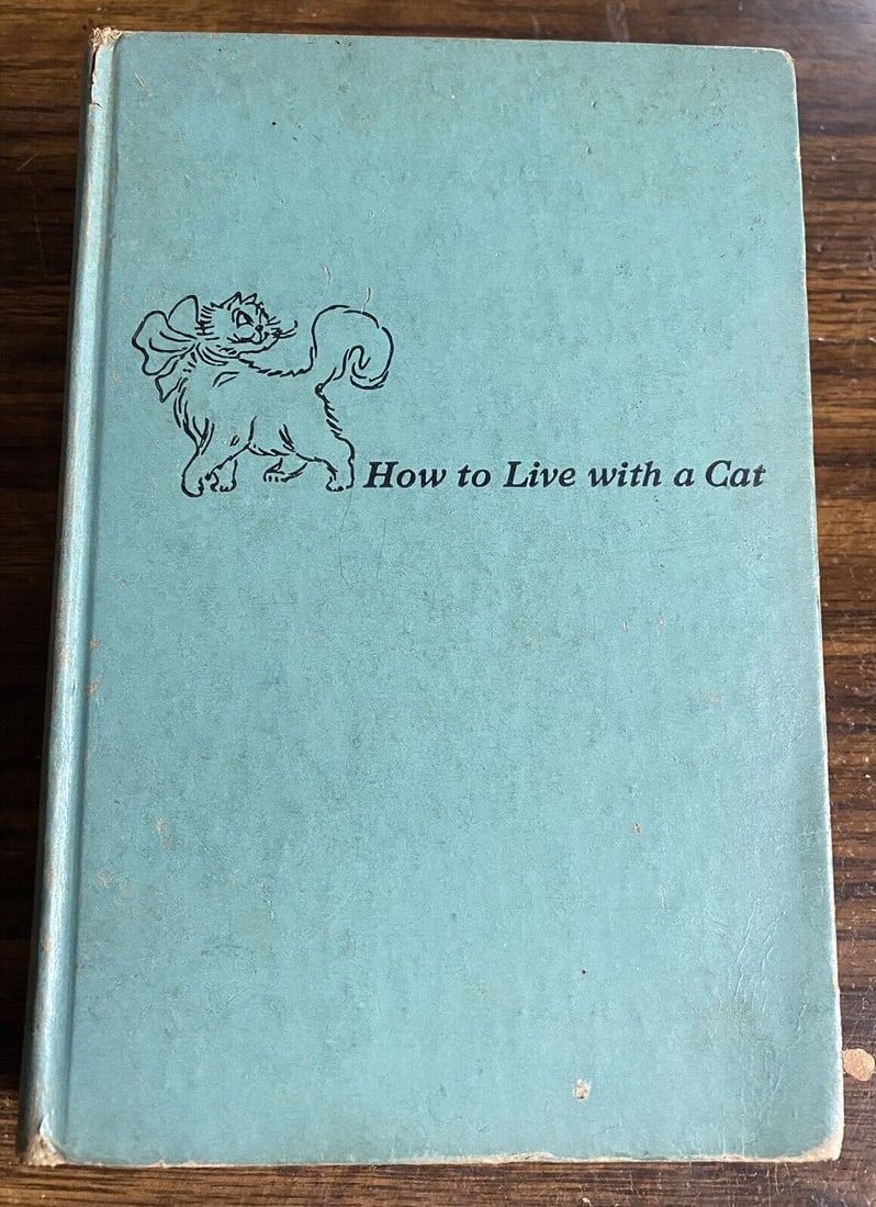 How To Live With A Cat Margaret Cooper Gay 1949 HC No DJ Simon Schuster 1st/4th: How To Live With A Cat by Margaret Cooper Gay 1949 First Edition/ Fourth Printing. Simon & Schuster. Illustrated by Roberta Macdonald. 267 pages. Blue cloth boards with title and cute illustration to