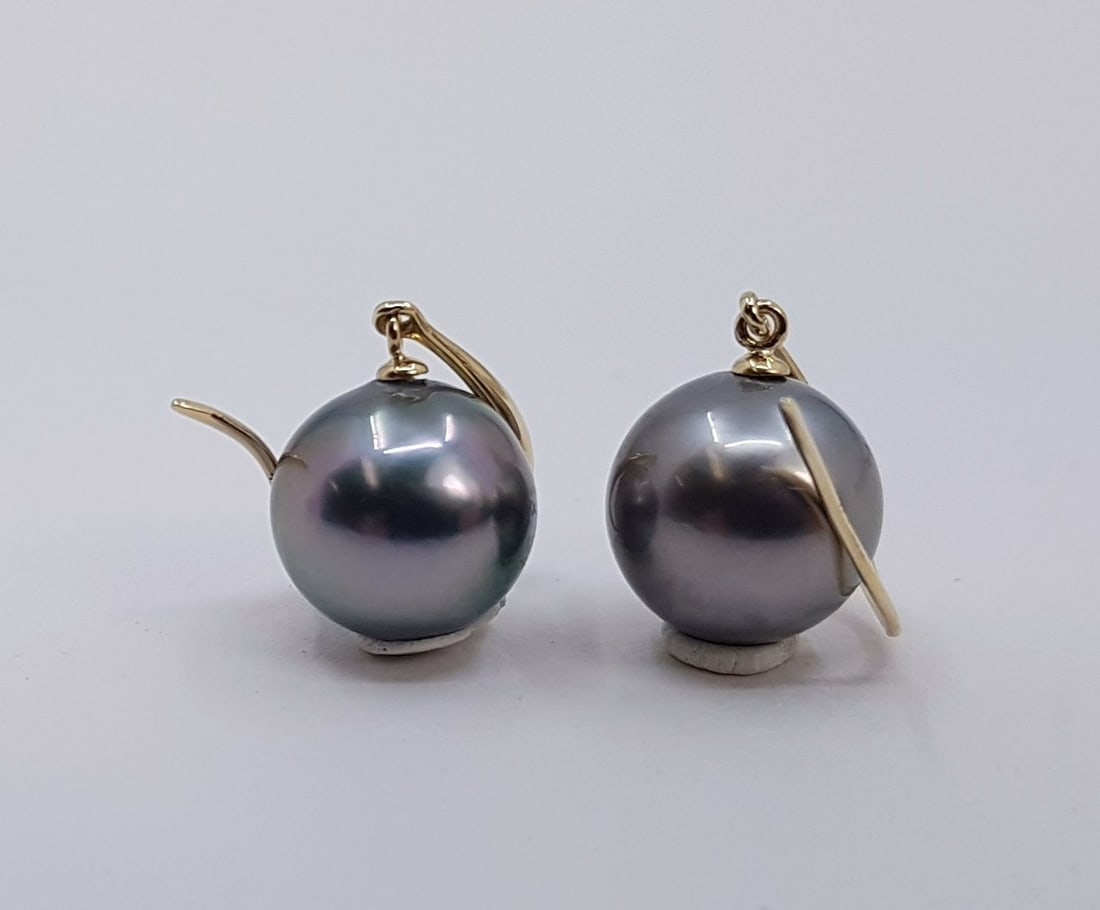 14 kt. Gold - Earrings - 9x10mm Peacock Tahitian Pearl Drops: Title: 14 kt. Gold - Earrings - 9x10mm Peacock Tahitian Pearl Drops Description: Produced by the Pinctada Margaritifera oyster in the tropical lagoons of French Polynesia, these pearls have a natural 