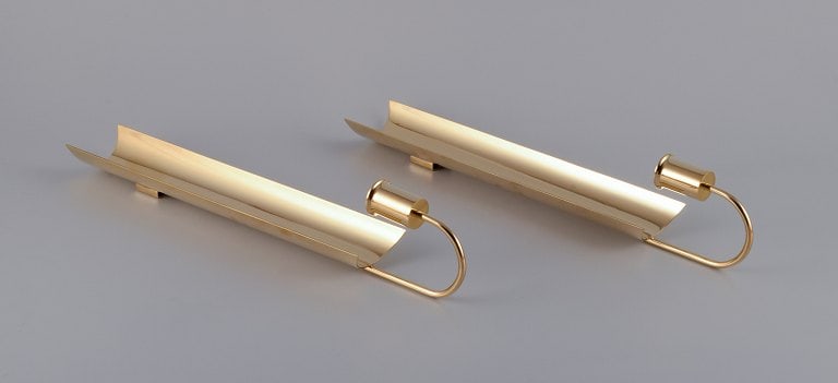Pierre Forssell for Skultuna. A pair of "Reflex" wall-mounted candle holders.: Title: Pierre Forssell for Skultuna. A pair of "Reflex" wall-mounted candle holders. Description: Pierre Forssell for Skultuna. A pair of "Reflex" wall-mounted candle holders. Polished brass. From the