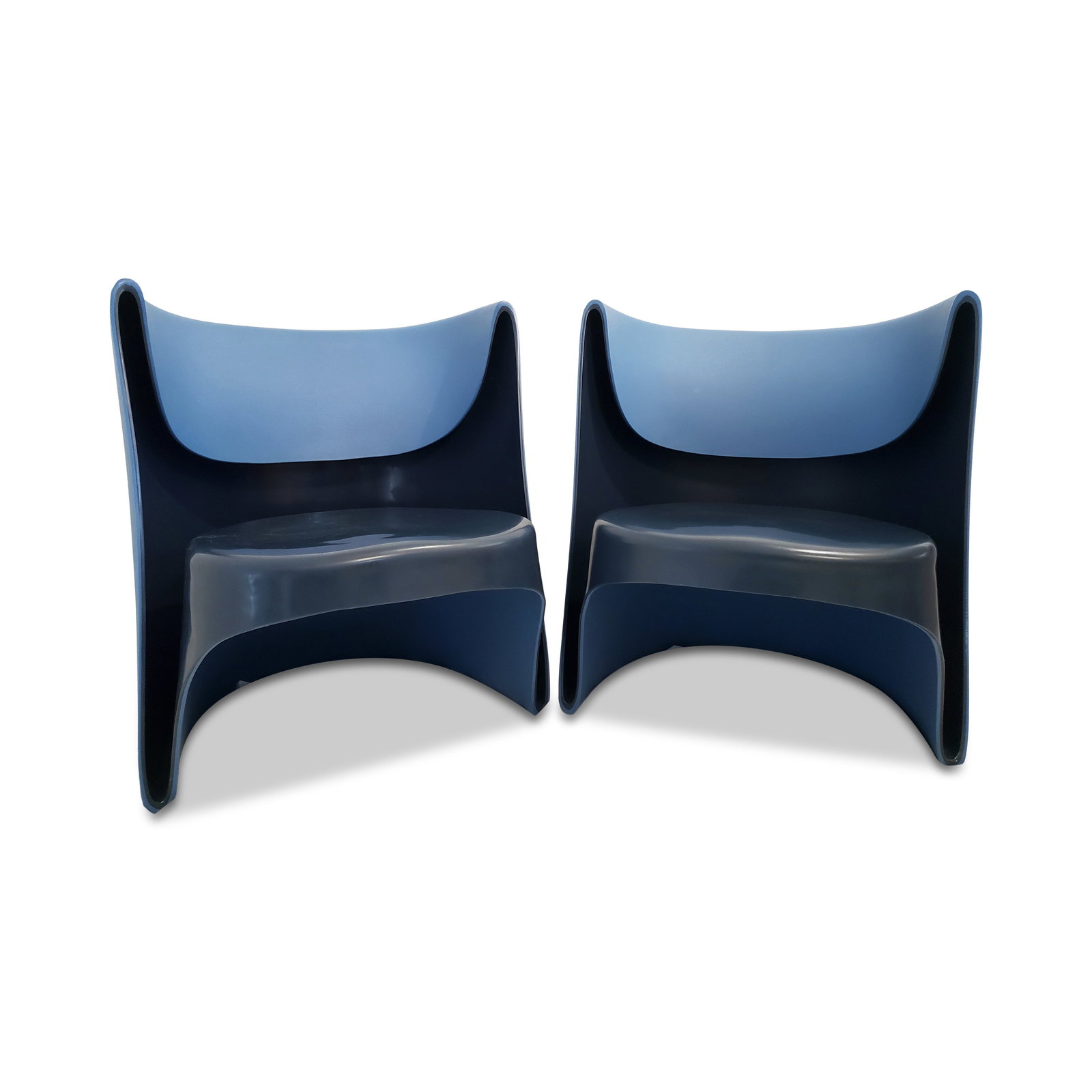 Pair of Nino Rota chairs by Ron Arad for Cappellini (2002): A pair of rare Nino Rota chairs in blue designed by Ron Arad for Cappellini in 2002. Reflecting Arad's exploration of forms and production processes, these twin-wall polyethylene chairs were construct