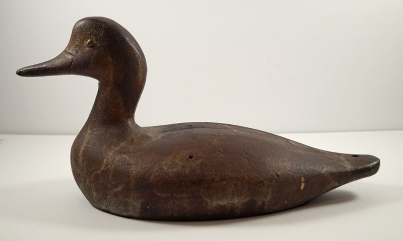 Duck Cast Iron Sink Box Hunting Decoy: Title: Duck Cast Iron Sink Box Hunting Decoy Dimension: 7 1/2” tall x 14 1/4” long x 5 7/8” wide. Date: Ca. 1920’s-30. Additional Information: Wonderful full-figure solid casti