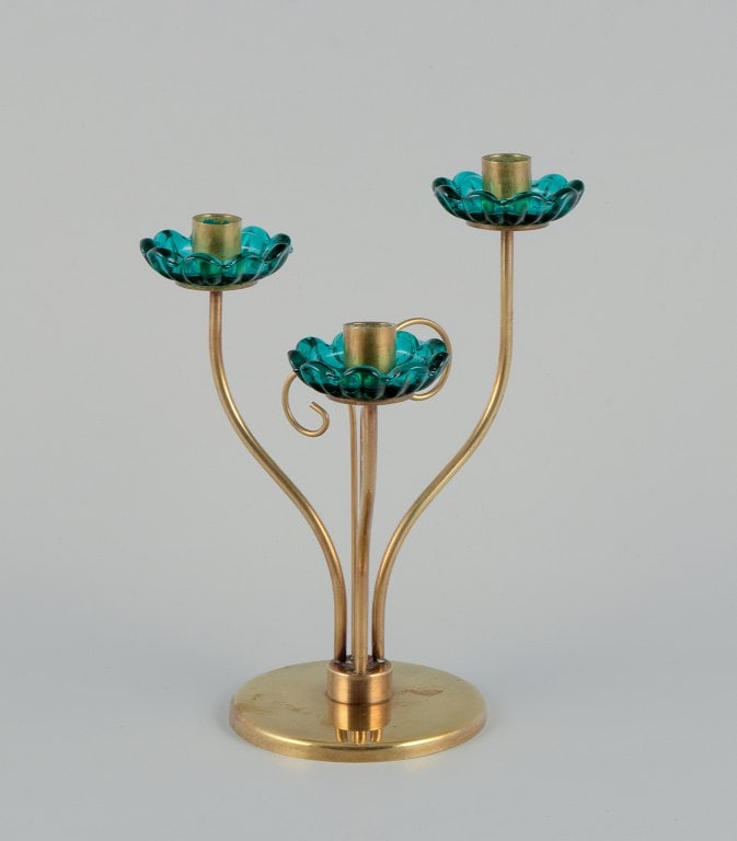 Gunnar Ander for Ystad Metall, Sweden. Brass candlestick holder with turquoise glass sleeves. For: Title: Gunnar Ander for Ystad Metall, Sweden. Brass candlestick holder with turquoise glass sleeves. For three candles. Description: Gunnar Ander for Ystad Metall, Sweden. Brass candlestick holder wit
