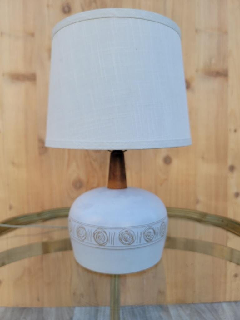 Mid Century Modern Jane & Gordon Martz Ceramic with Walnut Table Lamp with Linen Shade: Vintage from the 1950s Materials: Linen Width: 12 inches Height: 21 inches Depth: 12 inches Mid Century Modern Jane & Gordon Martz Ceramic with Walnut Table Lamp with Linen Shade Gorgeous Mid Century