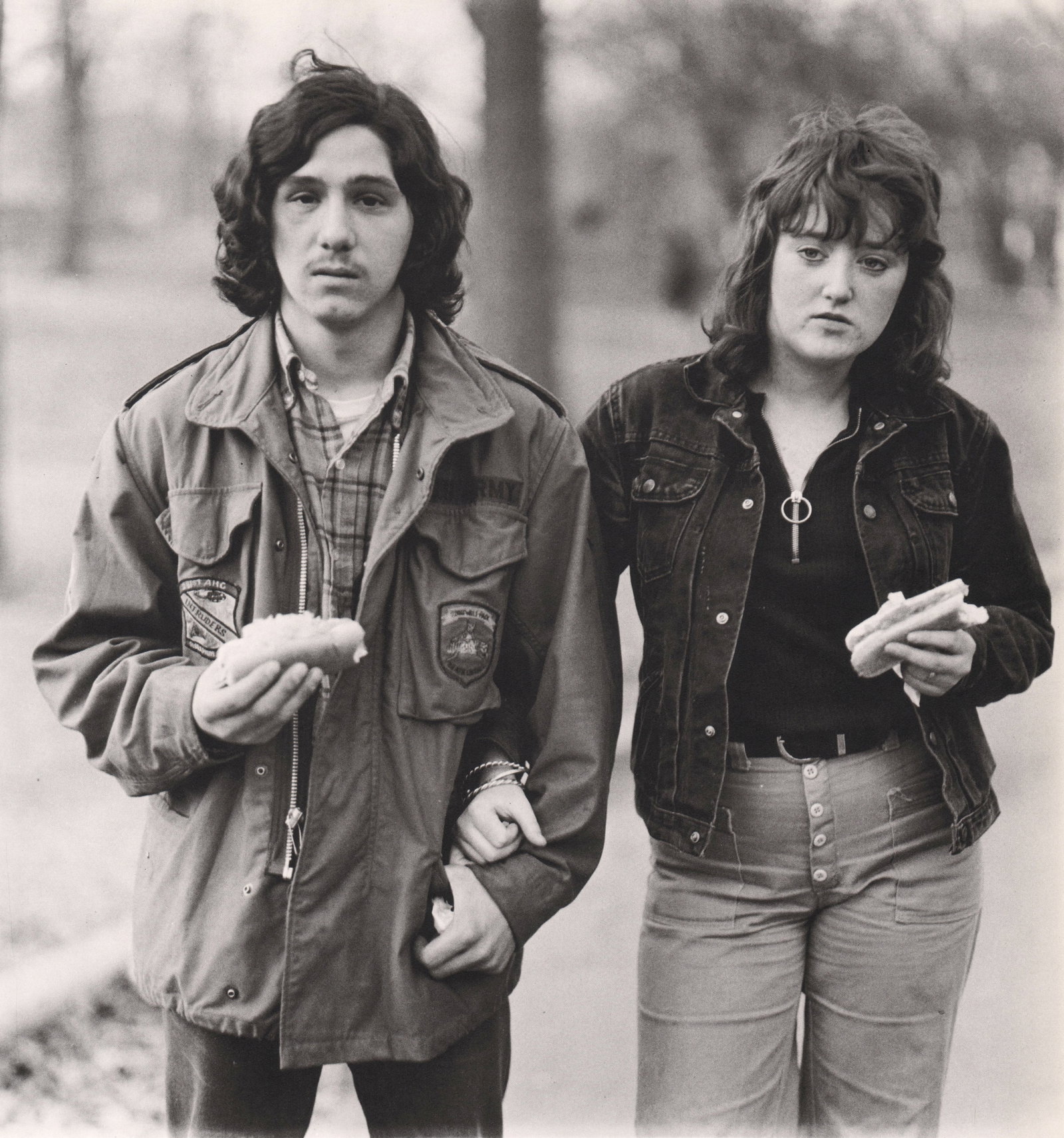 DIANE ARBUS - Young man & his girlfriend with hot dogs in the park, NYC, 1971: Artist: DIANE ARBUS Print Title: Young man & his girlfriend with hot dogs in the park, NYC, 1971 Medium: Medium: Photoengraving Printed 1970’s in the USA Image size (inches) approx. 8 x 8”