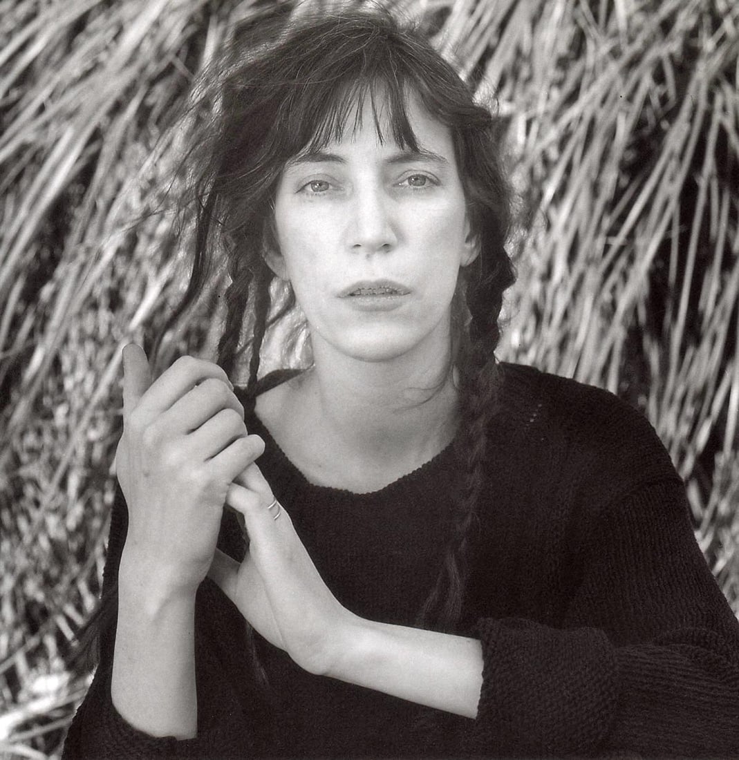 MAPPLETHORPE - Patti Smith,1987: Artist: MAPPLETHORPE Print Title: Patti Smith,1987 Medium: Duotone Photo-lithograph Printed 1990’s in Italy Image size (inches) approx.7.5 x 7.5” Robert Mapplethorpe was an American photog