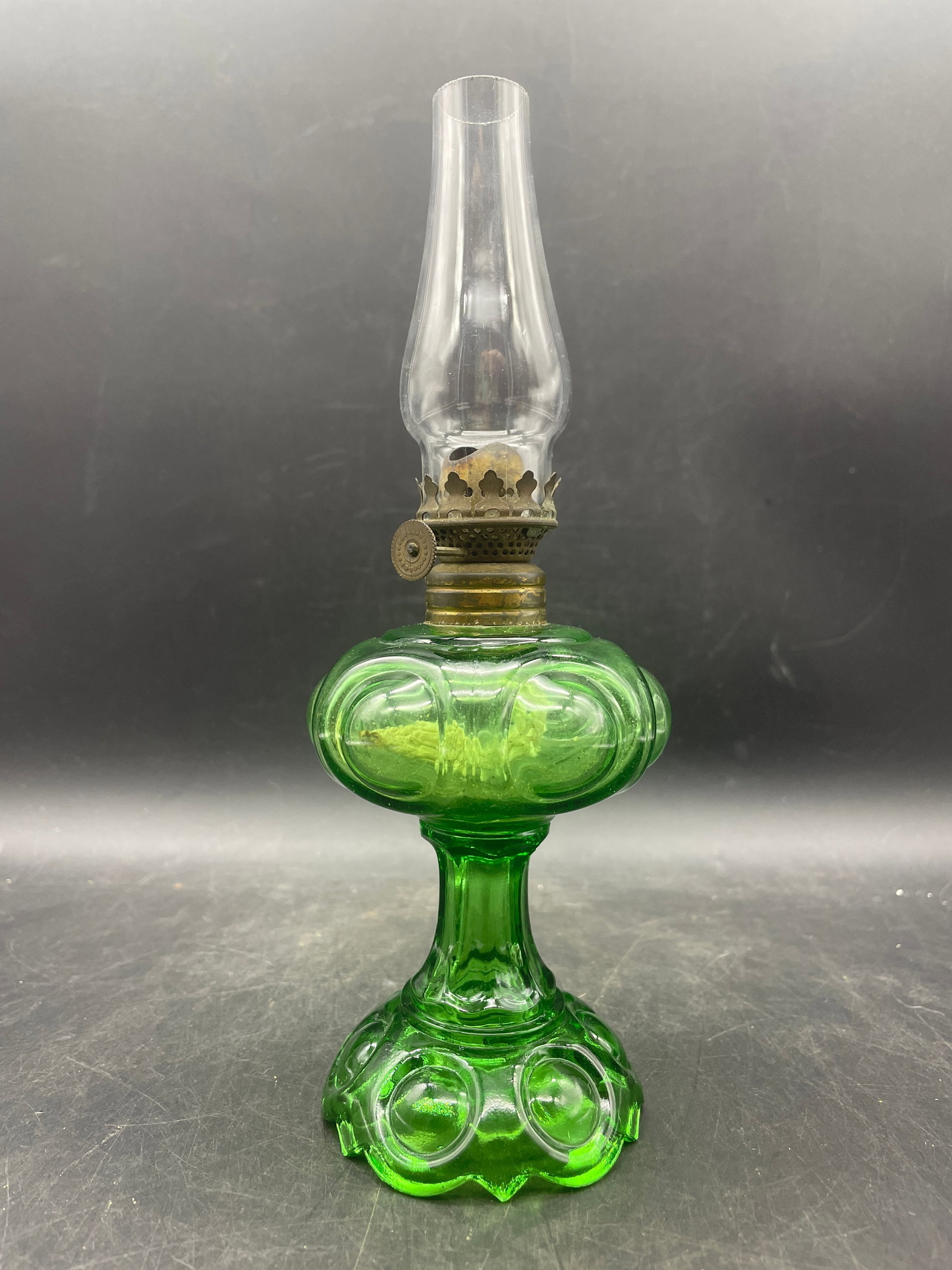 Daisy Oil Lamp Green Glass: Title: Daisy Oil Lamp Green Glass Date/Period: unknown Dimension: approx 9 x 3 Material: glass Additional Information: Daisy Oil Lamp Green Glass Shipping: Domestic: Flat-rate of $17.00 to anywhere wi