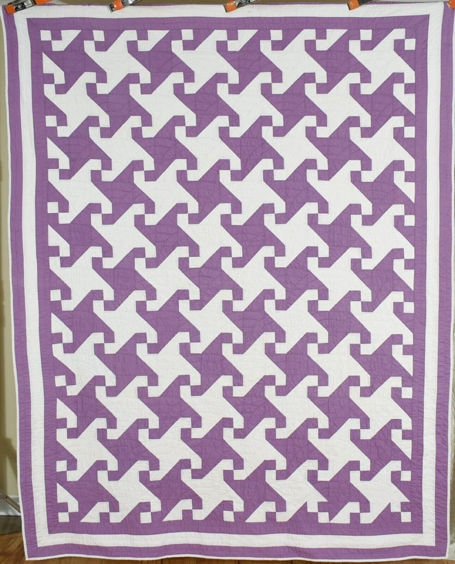 Graphic 30's Indiana Puzzle Quilt: This beautiful cotton 1930's lavender and white Indiana puzzle quilt is all hand pieced and hand quilted, with a graphic Escher-like design where the white background mirrors the lavender pattern. It 