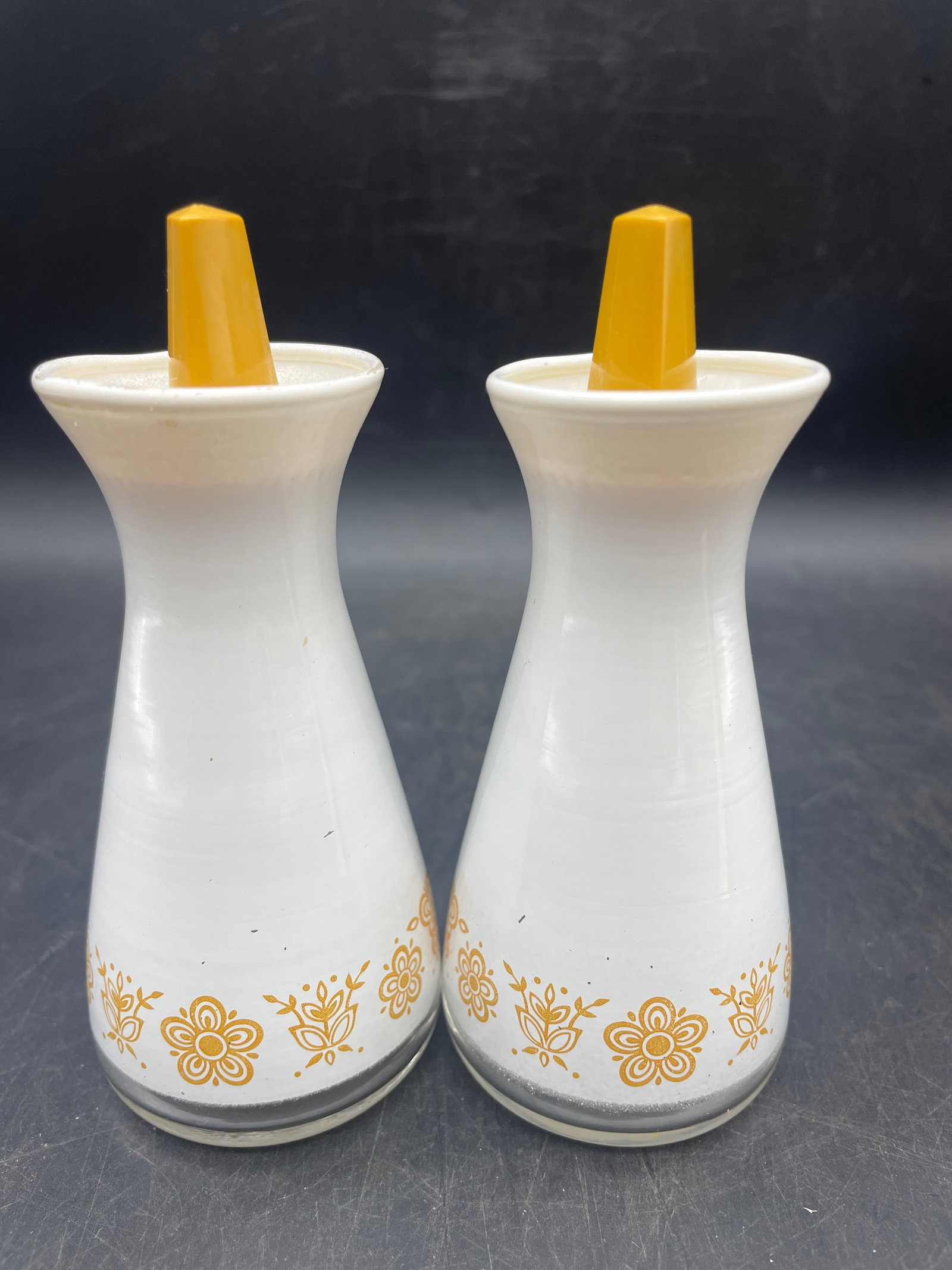 VINTAGE PYREX BUTTERFLY SALT AND PEPPER SHAKERS: Title: VINTAGE PYREX BUTTERFLY SALT AND PEPPER SHAKERS Date/Period: UNKNOWN Dimension: approx 4.5 x 1.75" Material: glass Additional Information: VINTAGE PYREX COMPATIBLES GOLD BUTTERFLY WHITE GLASS S