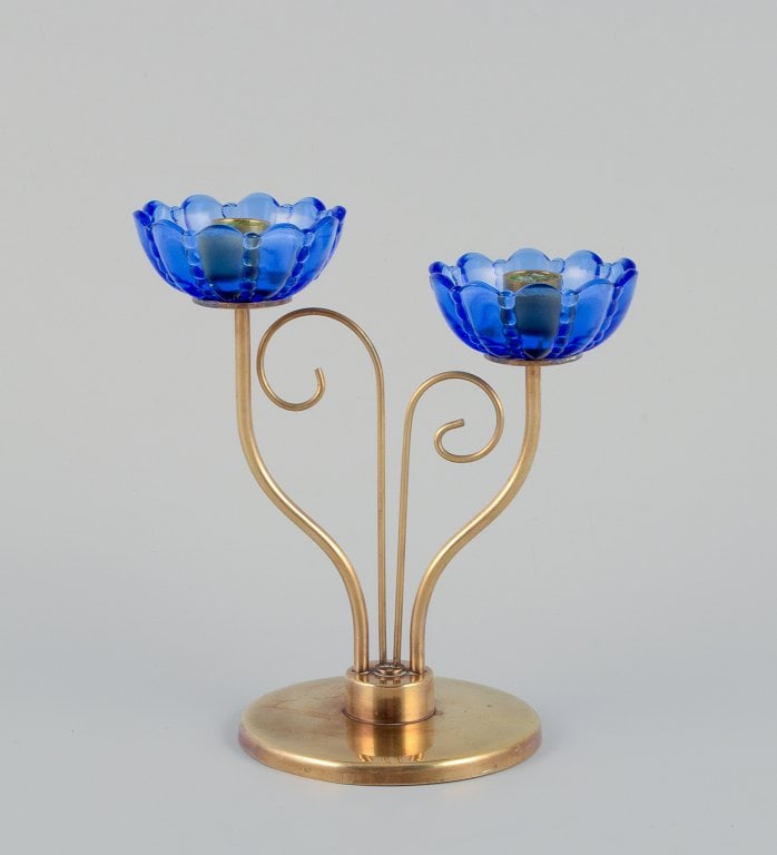 Gunnar Ander for Ystad Metall, Sweden. Brass candlestick holder with blue glass sleeves. For two: Title: Gunnar Ander for Ystad Metall, Sweden. Brass candlestick holder with blue glass sleeves. For two candles. Description: Gunnar Ander for Ystad Metall, Sweden. Brass candlestick holder with blue