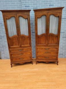 Vintage French Country Walnut Armoire by John Widdicomb - Pair: Vintage from the 1940s Materials: wood, walnut, wire, fabric Width: 32 inches Height: 75.5 inches Depth: 17.5 inches Vintage French Country Walnut Armoire by John Widdicomb - Pair Gorgeous French Coun