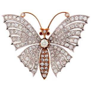 Victorian Diamond Ruby Gold Butterfly Brooch Pin: Amazing Victorian butterfly brooch created on the turn of 20th century in France. Made of 18k (tested) yellow and white gold and encrusted with 135 old mine cut diamonds. The diamond in the center is