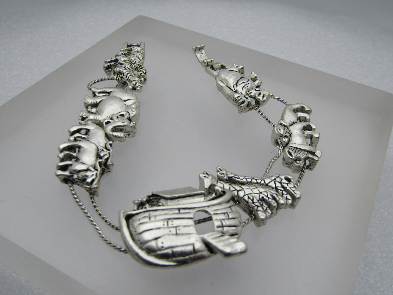 Vintage Noah's Ark Slide Charm Bracelet, 7.75": Vintage Noah's Ark Slide Charm Bracelet, 7.75", Silver tone with satiny and shiny finish. The charms (Ark, giraffes, yak, lion, elephant pairs slide on two chains with the zebras and rhinos set solidl