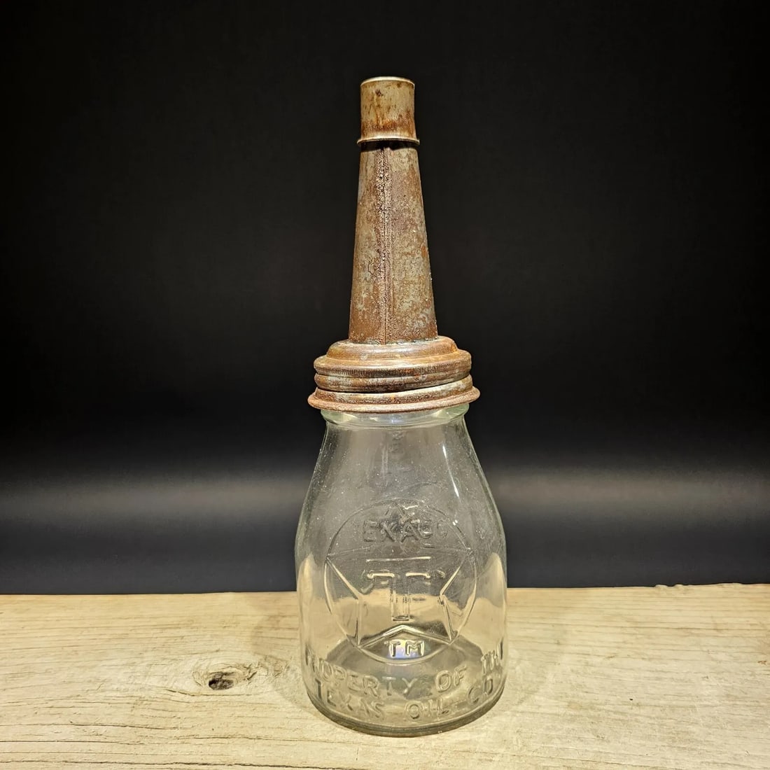 Glass 1 Pint "Texaco" Oil Bottle with Spout: 11" tall x 4" Wide Well made reproduction antique Texaco 1 Pint oil bottle. It's hard to see in the pictures, but it has the Texaco logo and Property of the Texas oil co on the one side. Then Fill to