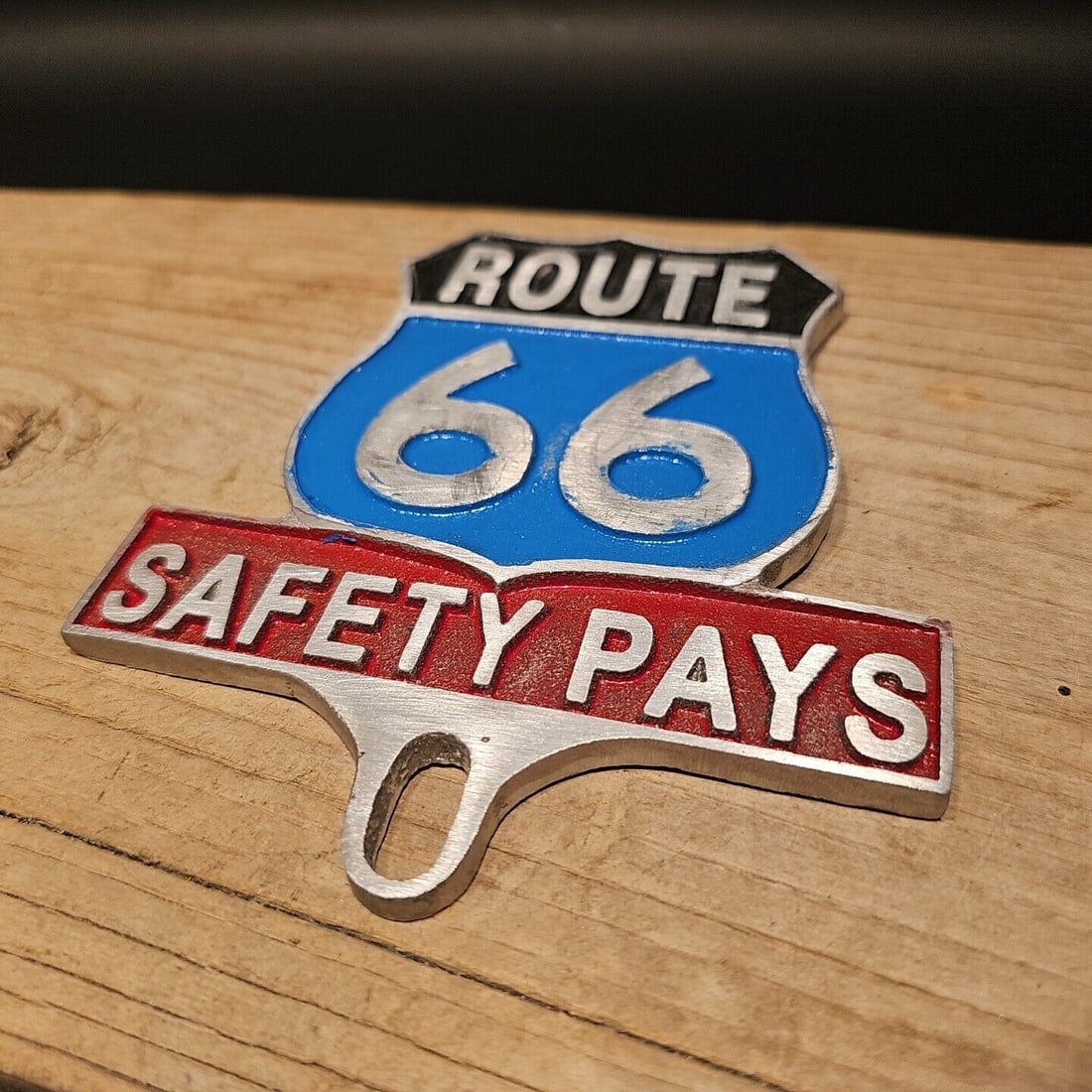Route 66 Safety License Plate Fob Topper: 5 1/2" tall x 4 3/4" wide Wonderful reproduction safety license plate topper. Good detail aluminum, slightly aged to look like an antique. Certainly hard to tell its age. Reserve: $20.00 Shipping: Dom
