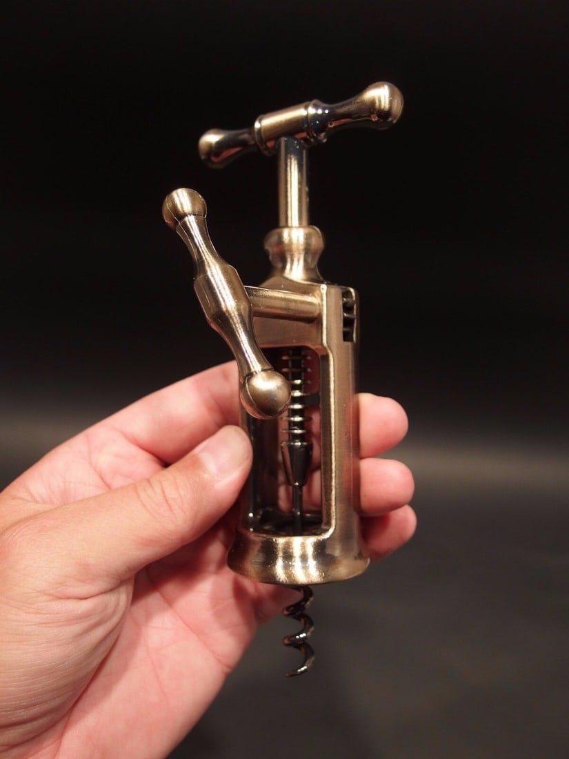 Rack & Pinion Kings Corkscrew Wine Bottle Opener: Wonderful reproduction of an antique gadget. Incredibly easy to use, it's also fun to watch in action. Simply extend the side handle fully to maximize the corkscrew's length. Gently rotate the handle 