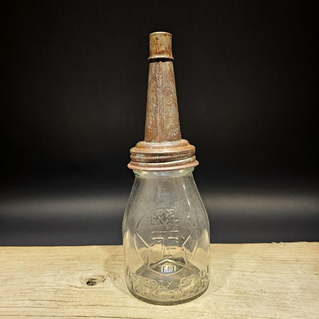 Glass 1 Pint "Texaco" Oil Bottle with Spout: 11" tall x 4" Wide Well made reproduction antique Texaco 1 Pint oil bottle. It's hard to see in the pictures, but it has the Texaco logo and Property of the Texas oil co on the one side. Then Fill to