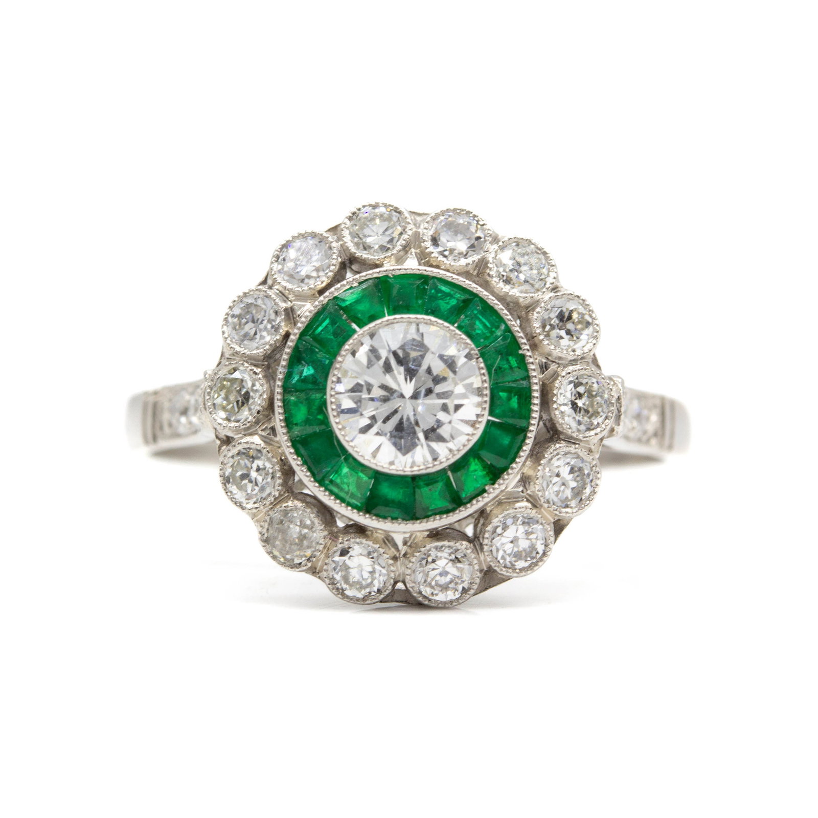 Handmade Platinum Old Mine Diamond and Emerald Engagement Ring: Materials: Platinum Gemstone: Diamond The Adelaide ring is a piece handmade in platinum. It centers one old European cut diamond of H color and -VS1 clarity that weighs 0.37ctw. The center stone is su