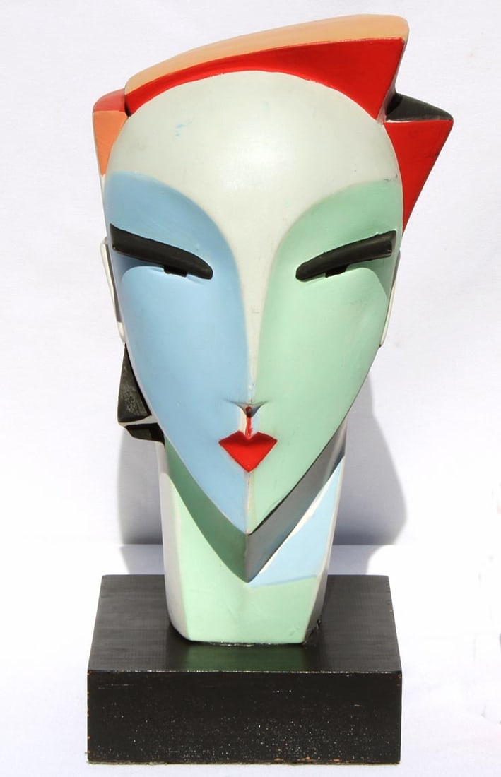 Brightly painted, stylized head made from bisque pottery (1 of 12)
