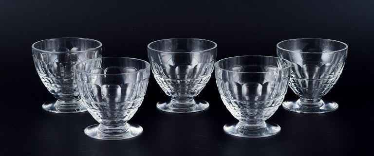 Baccarat, France, a set of five "Charmes" Art Deco white wine glasses in clear crystal glass.: Title: Baccarat, France, a set of five "Charmes" Art Deco white wine glasses in clear crystal glass. Faceted cut. Description: Baccarat, France, a set of five "Charmes" Art Deco white wine glasses in 